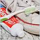clean sneakers with toothbrush