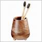 black and wood toothbrush holder