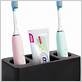black toothbrush and toothpaste holder