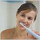 brushing dentures with electric toothbrush