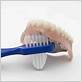 can you use a regular toothbrush on dentures