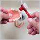 can you use a toothbrush on dentures