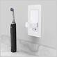 charging electric toothbrush in shaver socket