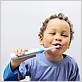 child using electric toothbrush