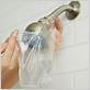 clean shower head with vinegar and baking soda