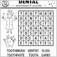 dental floss material crossword
