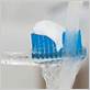 do you wet toothbrush before or after toothpaste