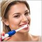 girl brushing teeth electric toothbrush