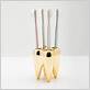 gold tooth toothbrush holder