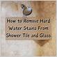 how to get hard water stains off shower head