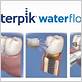 how to use a waterpik with implants