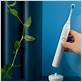 how to use an ultrasonic toothbrush
