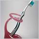 pink glass toothbrush holder