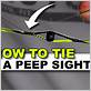 tying in a peep sight with dental floss