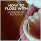using water flosser with permanent retainer
