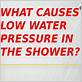 why is water pressure low in shower